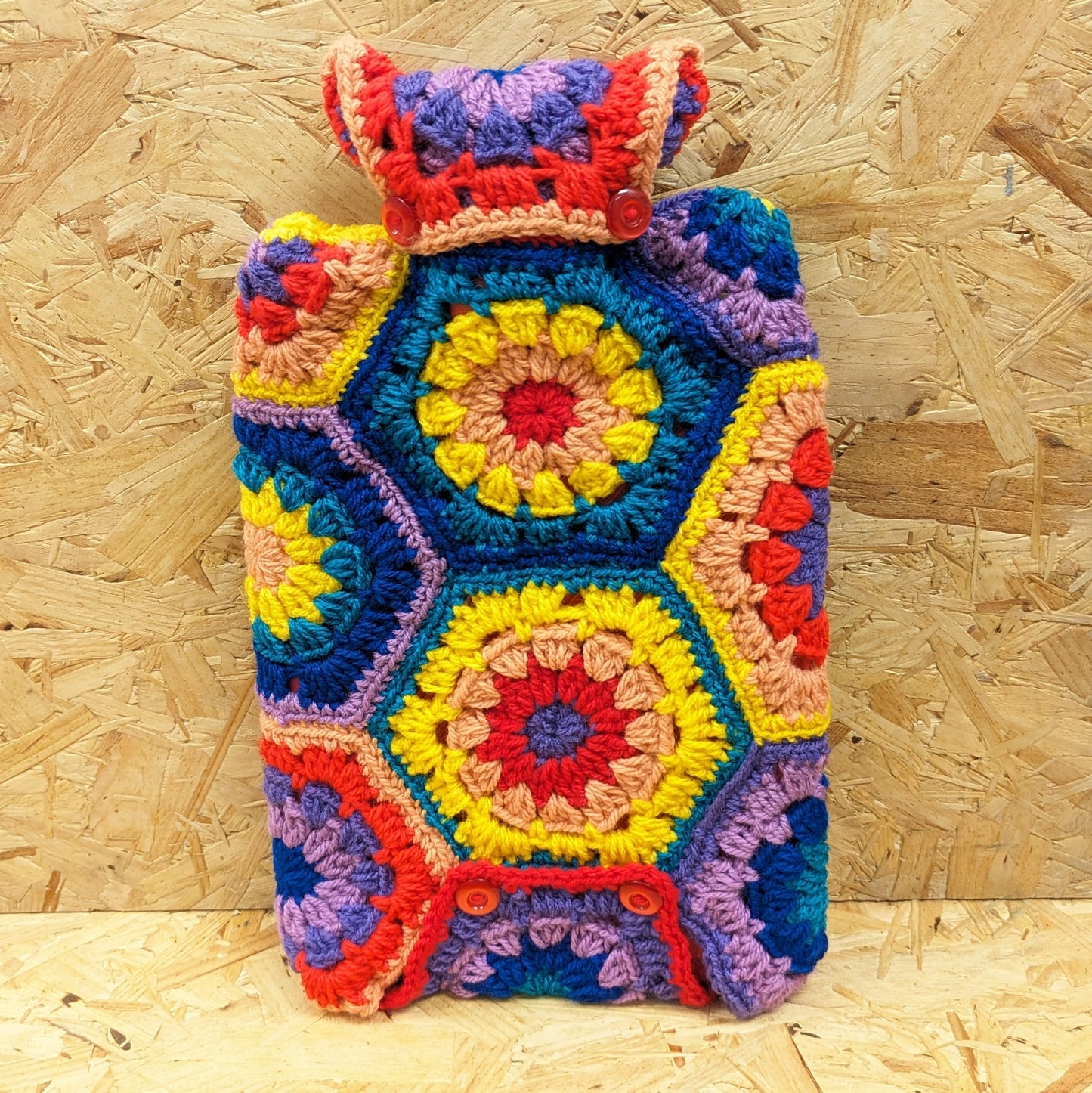 Granny square crochet hot water bottle