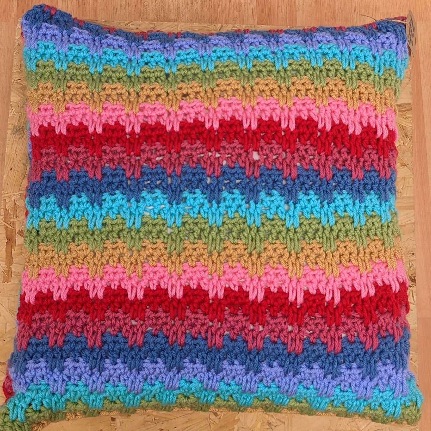 Large colourful handmade crochet pillow