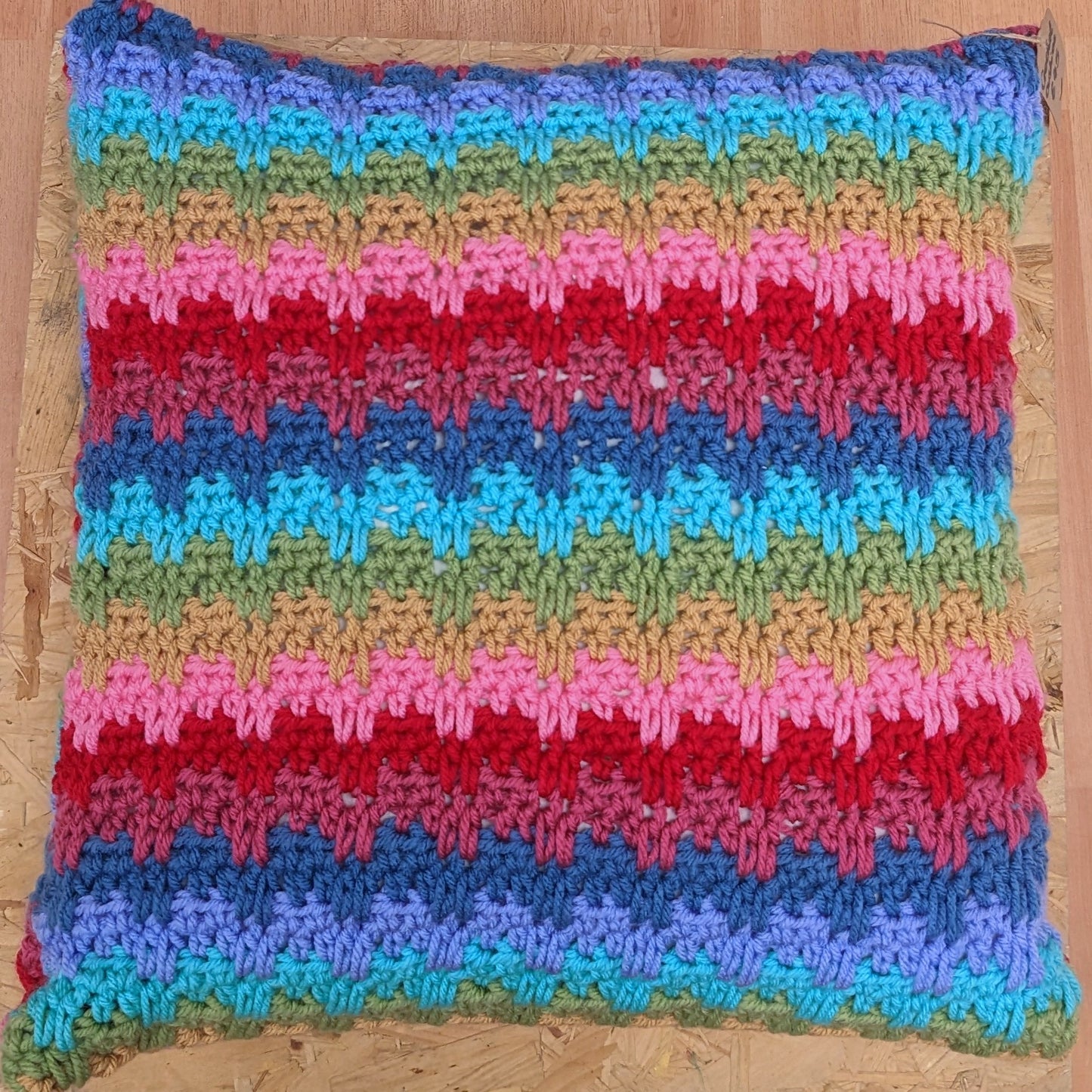 Large colourful handmade crochet pillow
