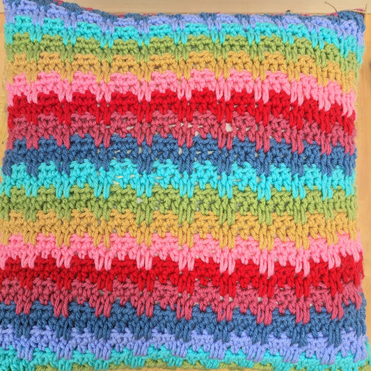 Large colourful handmade crochet pillow