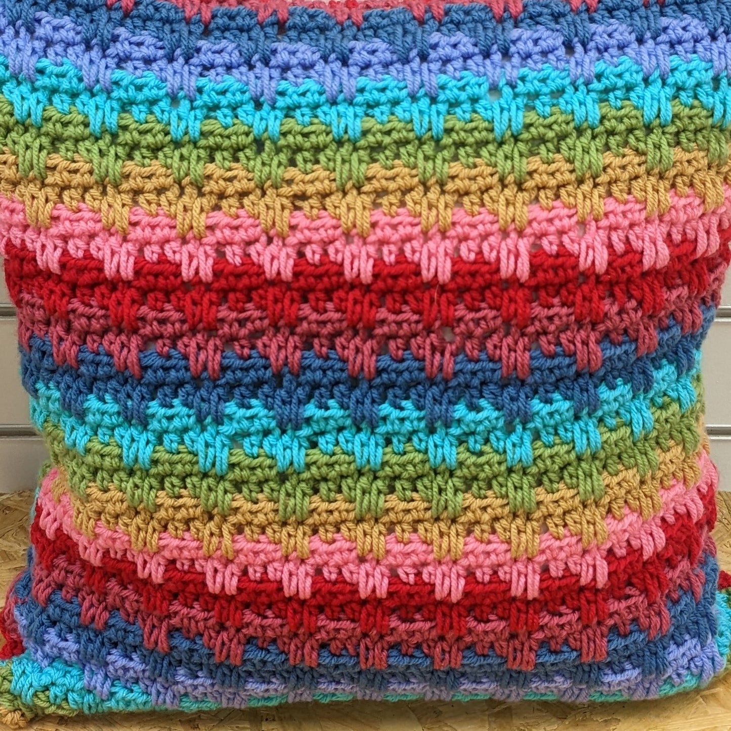 Large colourful handmade crochet pillow