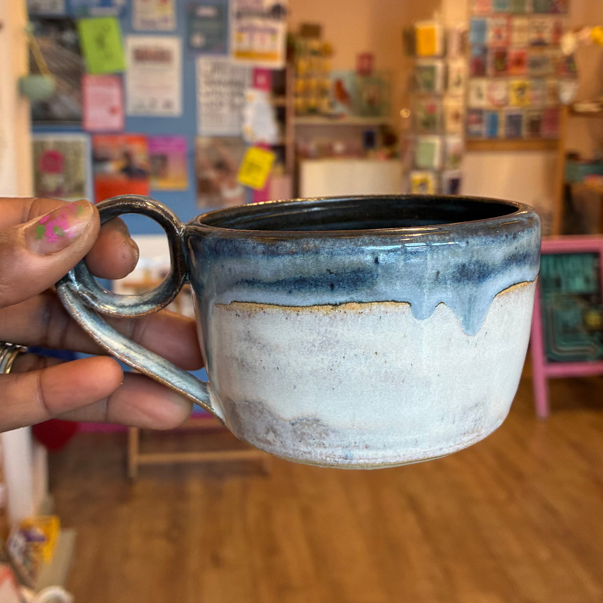 Blue glaze ceramic mug with roll handle