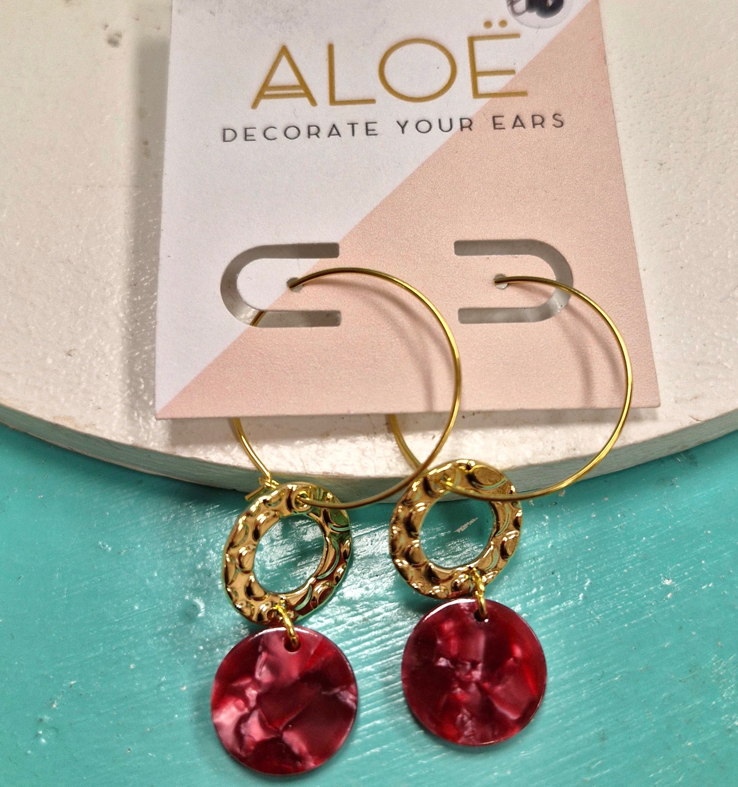 Gold circular drop earrings