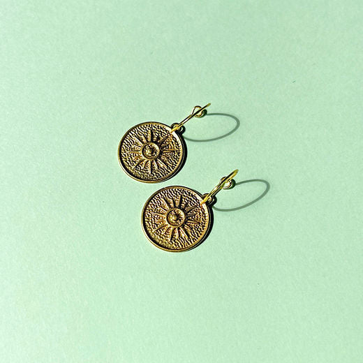 Gold coin styled hoop earring