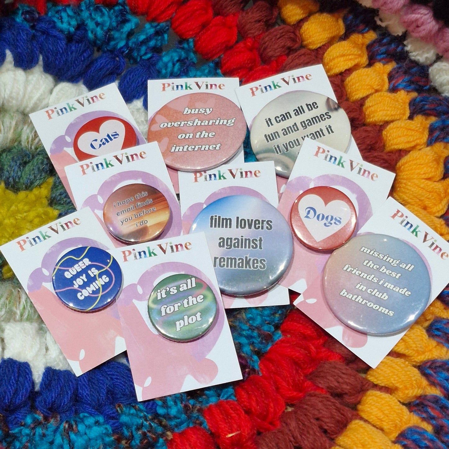 I line up of badges with fun sayings/musings