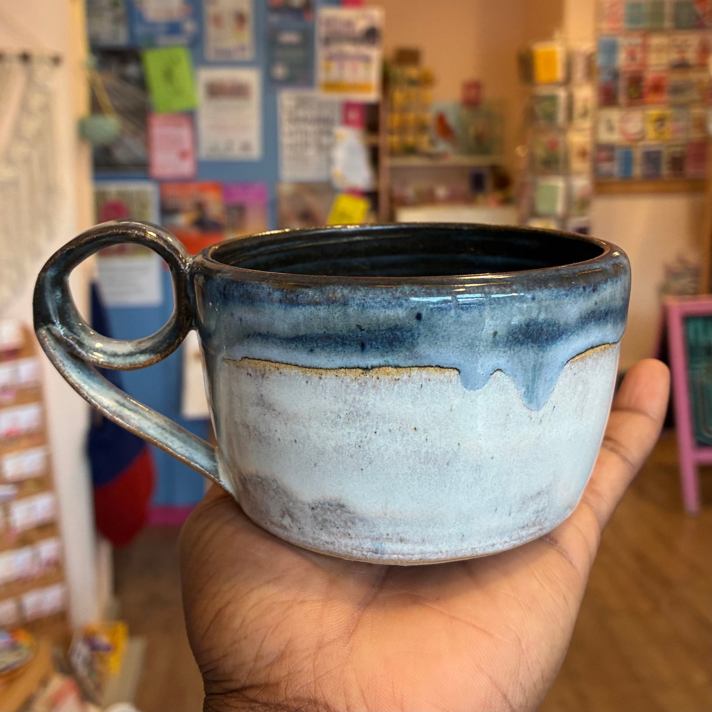 Blue glaze ceramic mug with roll handle