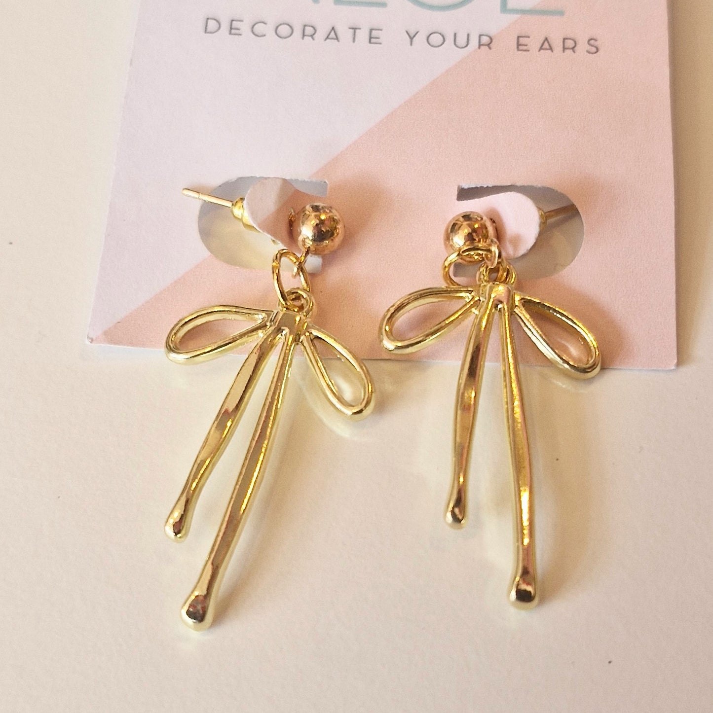 Gold bow stud earrings