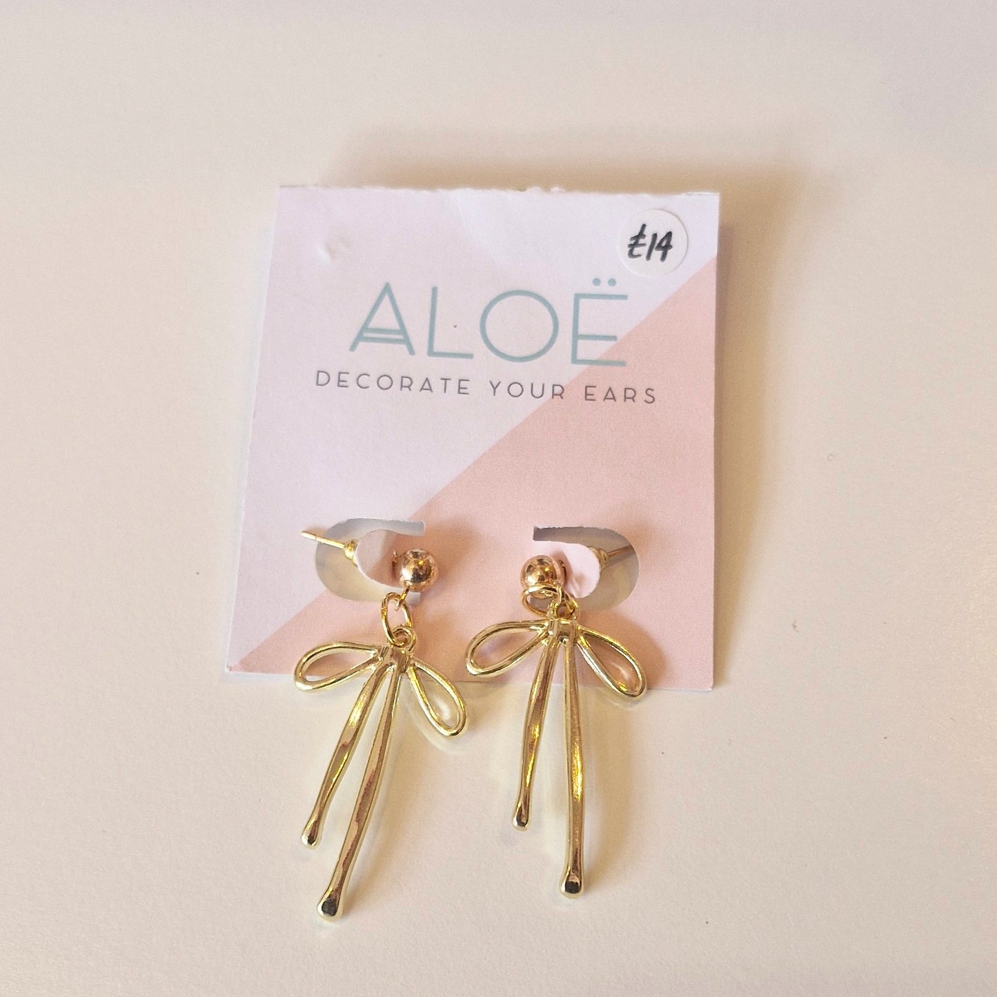 Gold bow stud earrings