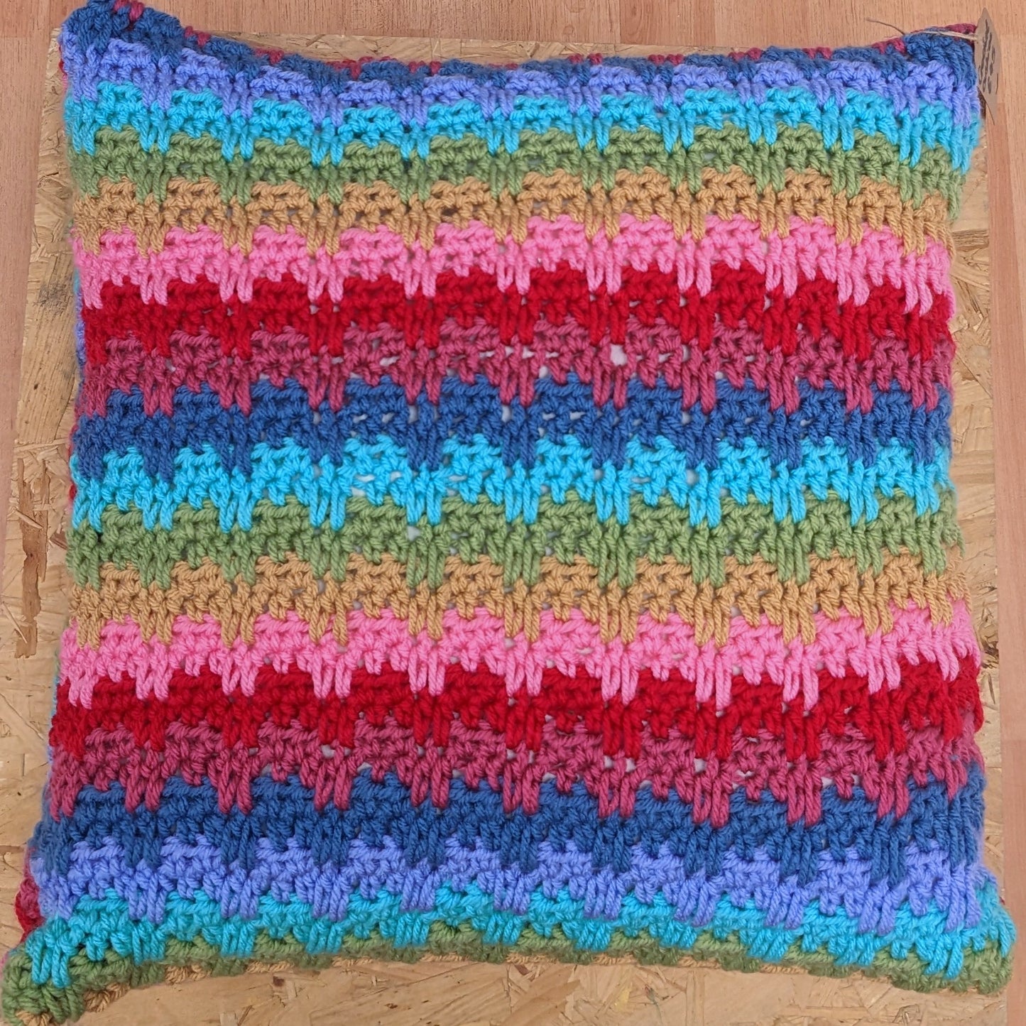 Large colourful handmade crochet pillow